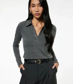 Lange mouwen polo zwarte dames top met steendetails