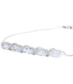 Witgouden armband met diamanten en topaas